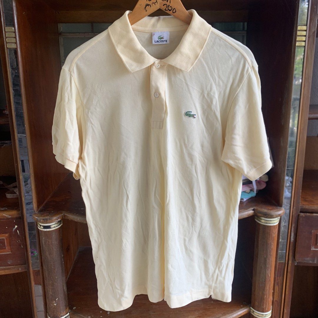 Light yellow lacoste short sleeve (Category: Tshirts & Polo Shirts ) located in Tarlac. Submitted by thriftwithass (Listing ID 1462766068, Image 1). Description: Dimes:21-27 Condition: 9.8/10 Color rate:10/10 ISSUE: NONE.