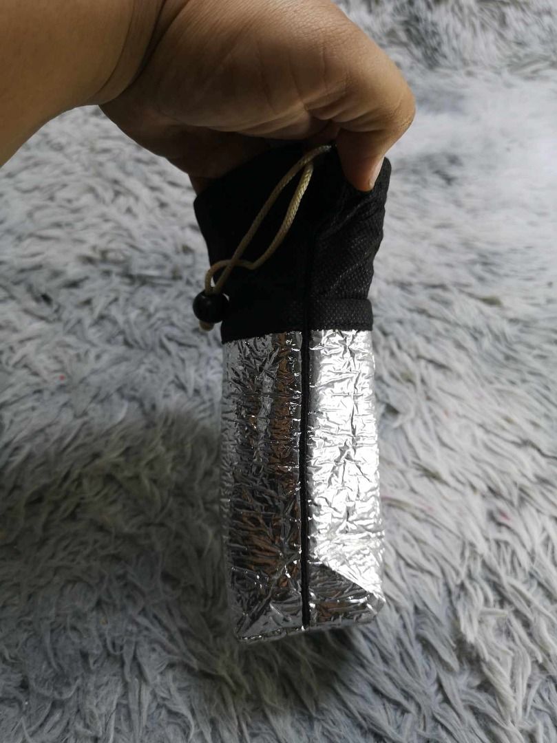 Lightweight Pouch With Reflective Foil Exterior (Category: Purses & Pouches) located in Santa Cruz. Submitted by jmy_surplus.2 (Listing ID 1462791528, Image 3). Description: Size ; L - 7.4 W - 4.4 Color ; Black , Silver Type ; Pouch Brand ; No brand Material ; Synhetic Style ; Black Silver Drawstring Pouch LR 129 JMY 5 Batch #222.