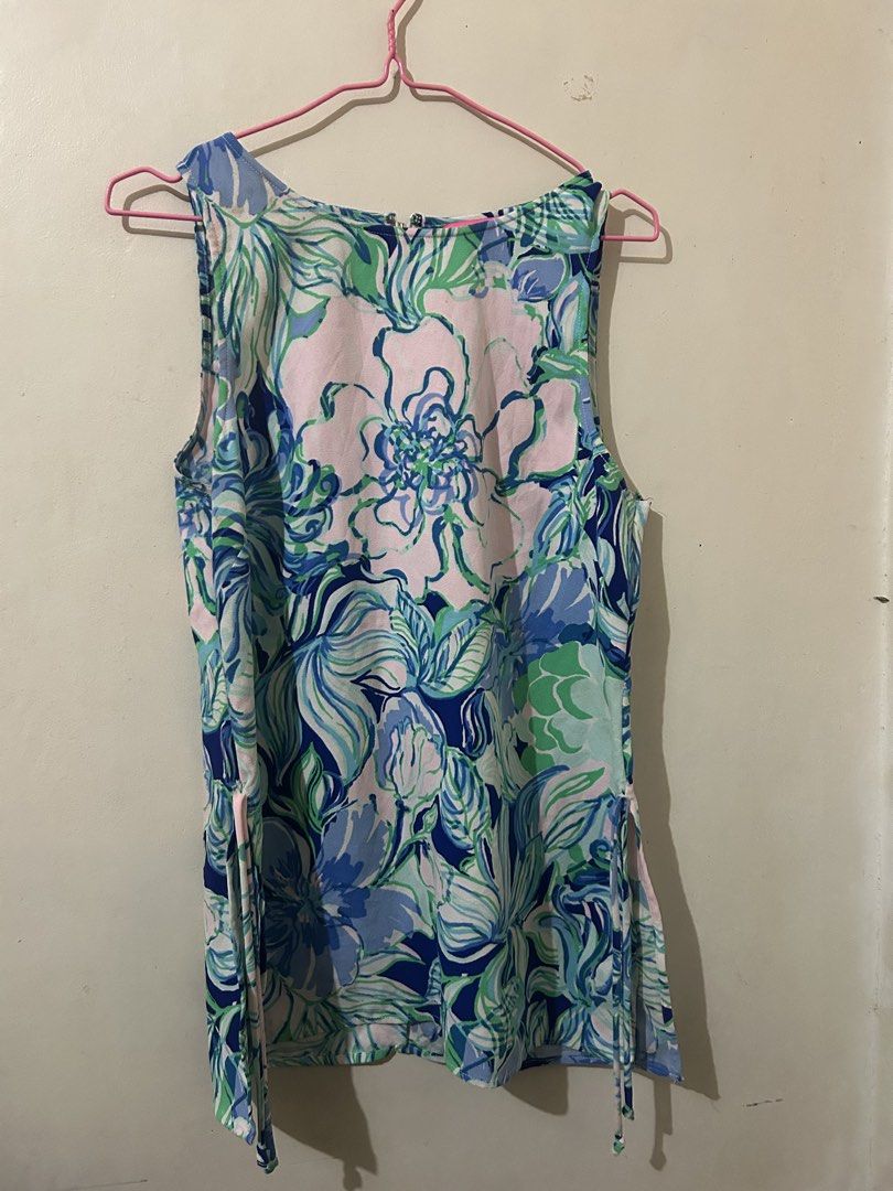 Lilly Pulitzer Sleeveless Floral Print Top (Category: Sleeveless) located in Naga. Submitted by aroaldaw (Listing ID 1462836739, Image 1). Description: - Cute sleeveless top from Lilly Pulitzer - Vibrant floral print in blues, greens, and pinks - Adjustable side ties for a custom fit - Perfect for warm weather - Made in China.