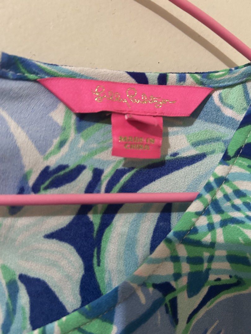 Lilly Pulitzer Sleeveless Floral Print Top (Category: Sleeveless) located in Naga. Submitted by aroaldaw (Listing ID 1462836739, Image 2). Description: - Cute sleeveless top from Lilly Pulitzer - Vibrant floral print in blues, greens, and pinks - Adjustable side ties for a custom fit - Perfect for warm weather - Made in China.