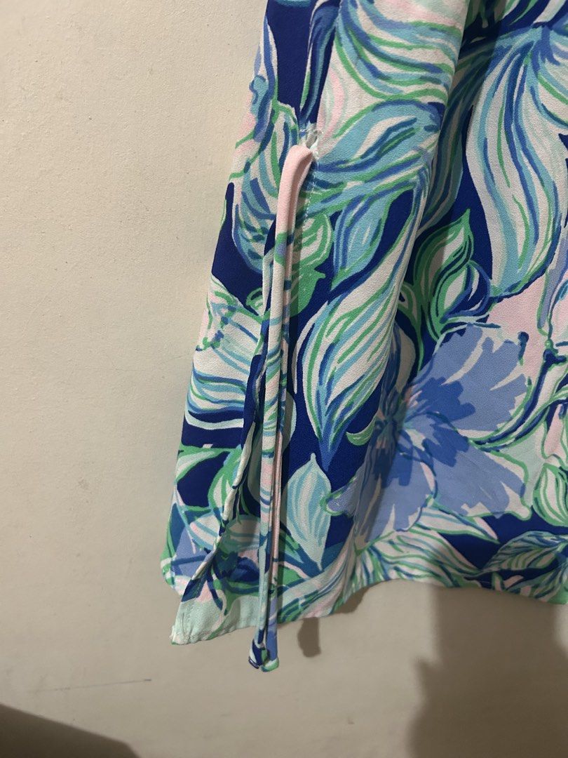 Lilly Pulitzer Sleeveless Floral Print Top (Category: Sleeveless) located in Naga. Submitted by aroaldaw (Listing ID 1462836739, Image 3). Description: - Cute sleeveless top from Lilly Pulitzer - Vibrant floral print in blues, greens, and pinks - Adjustable side ties for a custom fit - Perfect for warm weather - Made in China.
