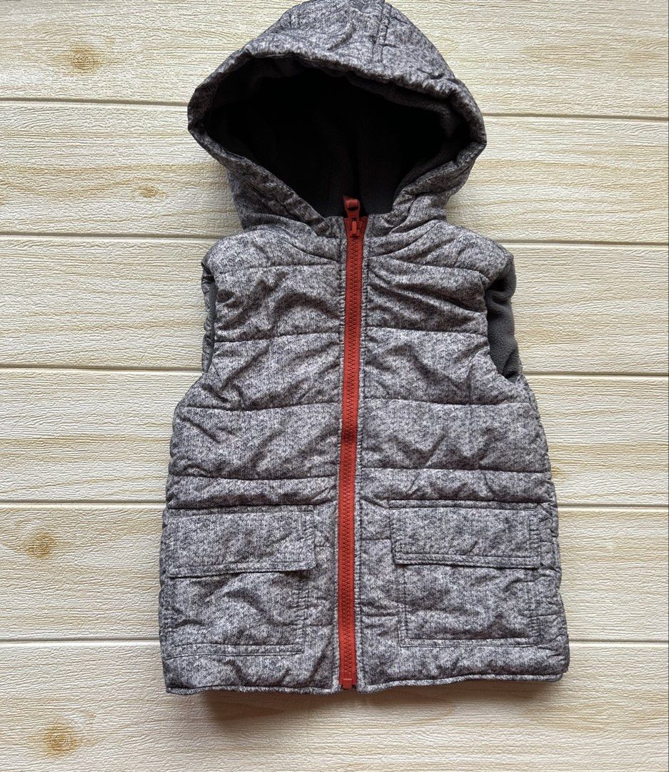 Little me puffer vest (Category: Babies & Kids Fashion) located in Cebu City. Submitted by yjainani (Listing ID 1462698882, Image 1). Description: gray marled toddler puffer vest featuring a bright red front zipper and an attached hood..