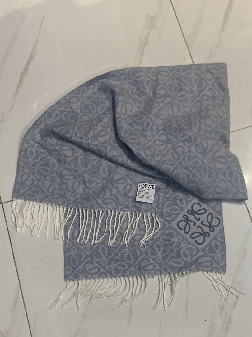Loewe Anagram Scarf Light Blue (Category: Scarves) located in Quezon City. Submitted by janisu0303 (Listing ID 1462843124, Image 3). Description: - Loewe Anagram wool and cashmere scarf - 12,500 php -authentic -distinguished by its all-over jacquard monogram pattern and classic fringed ends - Iconic Anagram pattern all over - Color: Light blue with white fringe - Made in United Kingdom - Dimensions: Approx. 180cm x 30cm - A stylish accessory to e