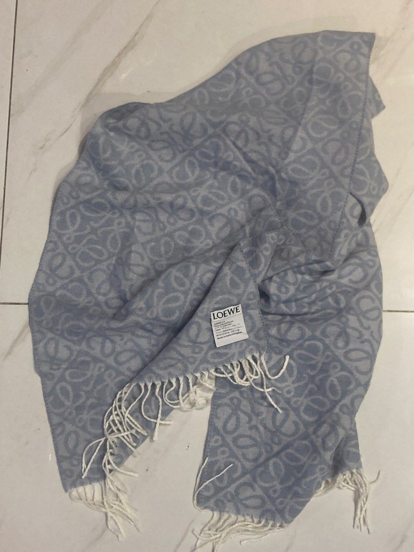 Loewe Anagram Scarf Light Blue (Category: Scarves) located in Quezon City. Submitted by janisu0303 (Listing ID 1462843124, Image 1). Description: - Loewe Anagram wool and cashmere scarf - 12,500 php -authentic -distinguished by its all-over jacquard monogram pattern and classic fringed ends - Iconic Anagram pattern all over - Color: Light blue with white fringe - Made in United Kingdom - Dimensions: Approx. 180cm x 30cm - A stylish accessory to e