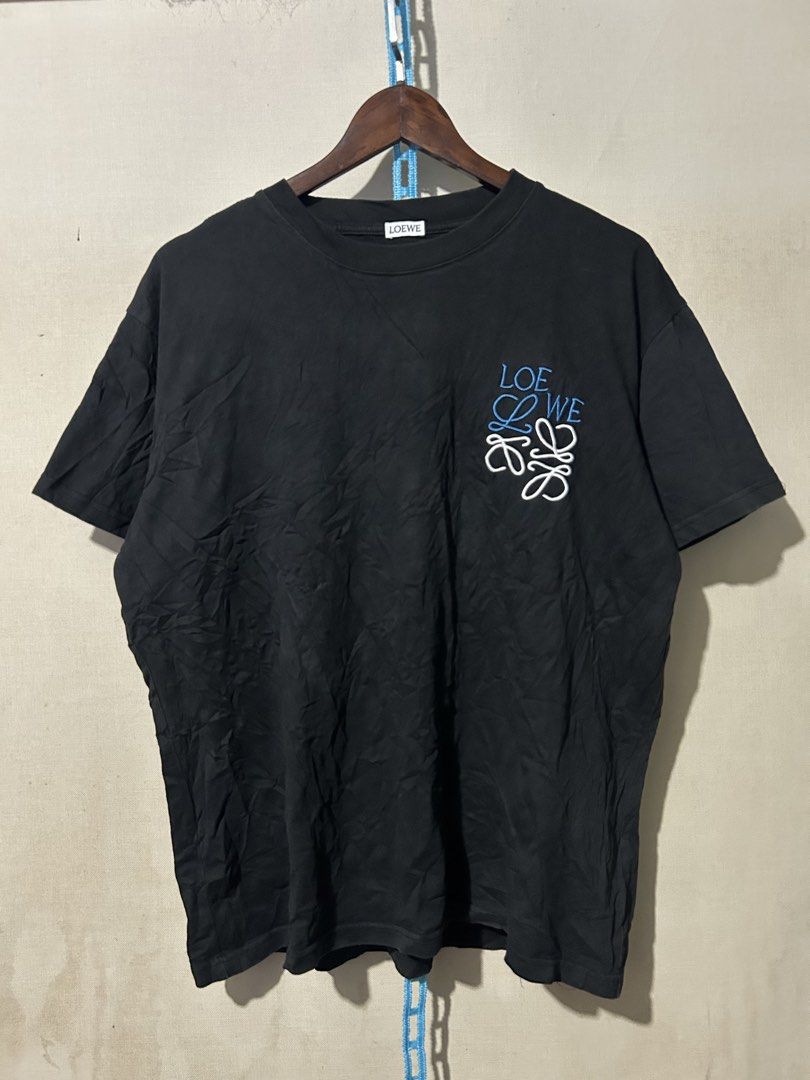 LOEWE embroidered tee (Category: Luxury Apparel) located in Santa Rosa. Submitted by unexpected.finds4026 (Listing ID 1462877769, Image 1). Description: Large on tag 24 W 28 L Best fit to L- XL complete tags heavy cloth 9.5/10 color rate no flaws .