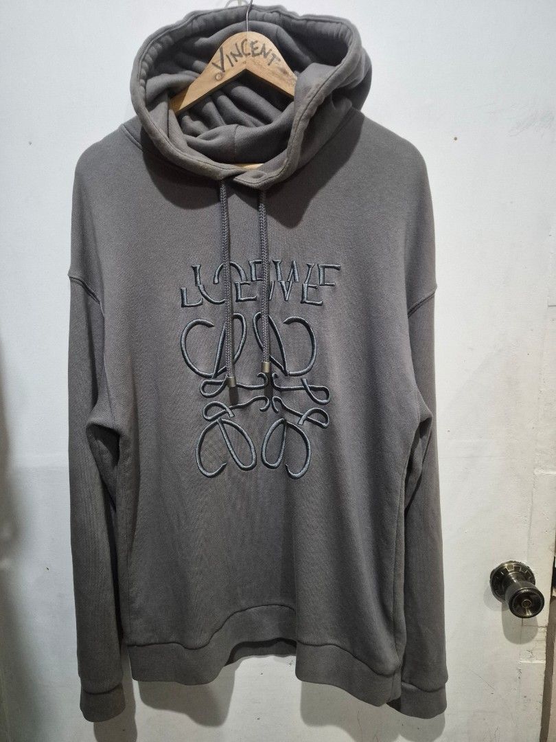 Loewe Grey Anagram Hoodie (Category: Hoodies) located in Bulacan. Submitted by vince4593 (Listing ID 1462856908, Image 2). Description: - Grey Loewe hoodie - Features embroidered Anagram logo on front - Drawstring hood with metal tips - Made in Portugal - Size: L - Ideal for casual wear - Has some minor issue on hood - Negotiable.