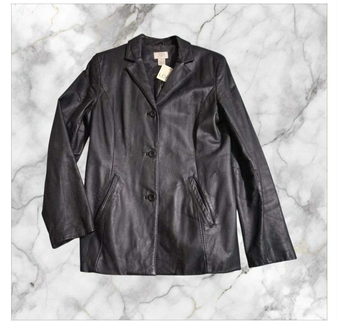 Loft Leather Jacket (Category: Others Tops) located in Paranaque City. Submitted by calm_youngstore7 (Listing ID 1462807270, Image 2). Description: Black leather blazer-style jacket from the brand LOFT. It features a single-breasted three-button front closure, classic notch lapels, structural panel stitching, and two slanted front waist pockets. This tailored silhouette is highly sought after as a versatile, minimalist staple piece..