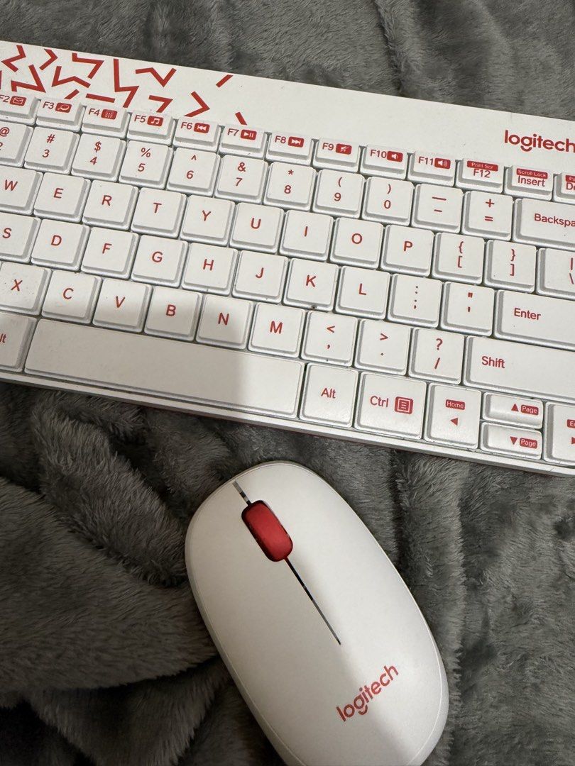 Logitech Wireless Keyboard and Mouse Combo White Red (Category: Computer Keyboard) located in Cainta. Submitted by amswardrobe (Listing ID 1462848712, Image 3). Description: - Logitech wireless keyboard and mouse set - Stylish white with red accents - Compact design, perfect for saving desk space - Both keyboard and mouse are in good working condition - Ready for a new home!.