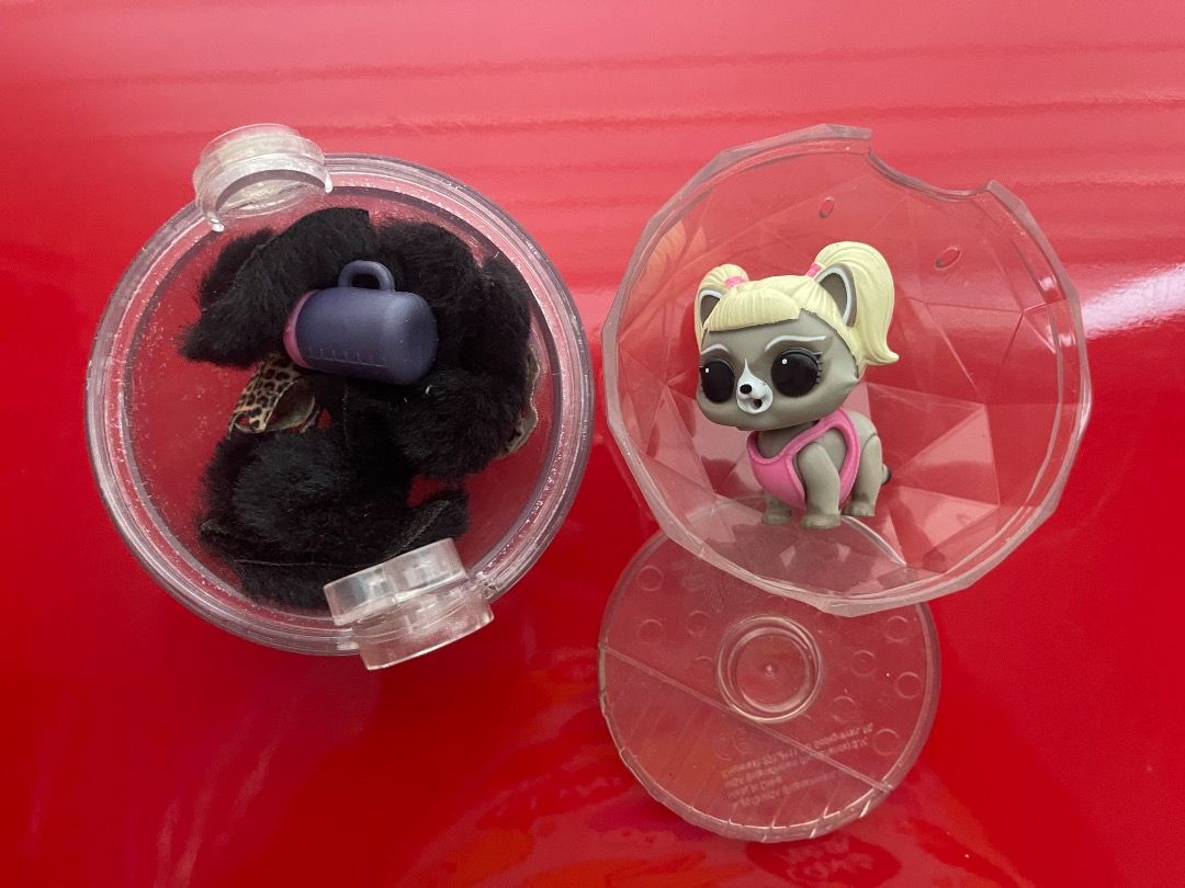 LOL Surprise Pet Ball with Accessories (Category: Kids Toys) located in Marikina City. Submitted by bezz_bezzy (Listing ID 1462846652, Image 1). Description: - LOL Surprise Pet ball set - Includes a fluffy black pet with purple accessory and leopard print collar - Comes with a separate LOL Surprise Pet doll (raccoon-like character with blonde pigtails and pink outfit) - Both toys are in their original clear plastic balls - Fun for kids!.
