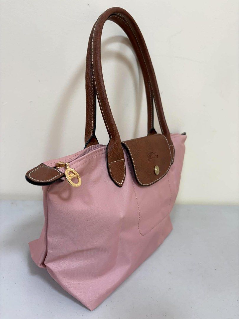 Longchamp Le Pliage Tote Bag Pink (Category: Luxury Bags & Wallets) located in Los Banos. Submitted by ukaynidizkie (Listing ID 1462871524, Image 2). Description: - Pink Longchamp Le Pliage Tote Bag - Genuine Leather Handles and Trim - Secure Zipper Closure with Snap Tab - Multiple Interior Pockets for Organization - Ideal Everyday Bag.