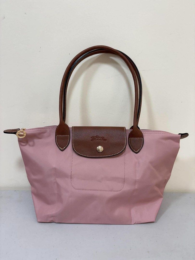 Longchamp Le Pliage Tote Bag Pink (Category: Luxury Bags & Wallets) located in Los Banos. Submitted by ukaynidizkie (Listing ID 1462871524, Image 1). Description: - Pink Longchamp Le Pliage Tote Bag - Genuine Leather Handles and Trim - Secure Zipper Closure with Snap Tab - Multiple Interior Pockets for Organization - Ideal Everyday Bag.