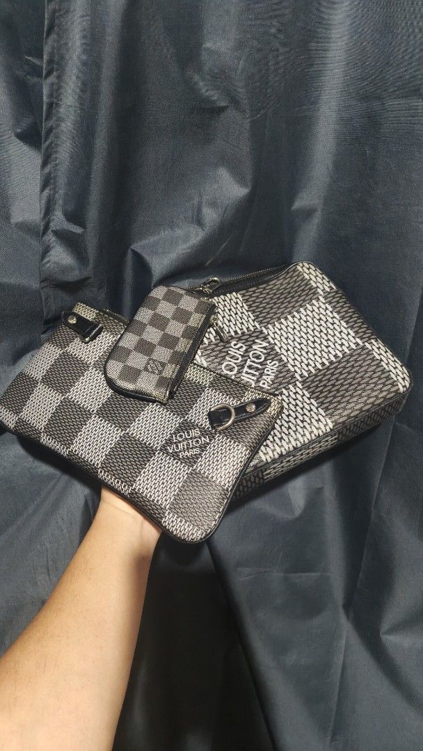 Louis Vuitton Damier Graphite Pouch Set with Strap (Category: Luxury Bags & Wallets) located in Iloilo. Submitted by jtguarnes (Listing ID 1462872569, Image 3). Description: - Authentic Louis Vuitton Damier Graphite pouch set - Includes main pouch and smaller front pouch - Detachable strap with 'LOUIS VUITTON' embossing - Signature Damier Graphite pattern throughout - Comes with original dust bag - Perfect for organizing your essentials.