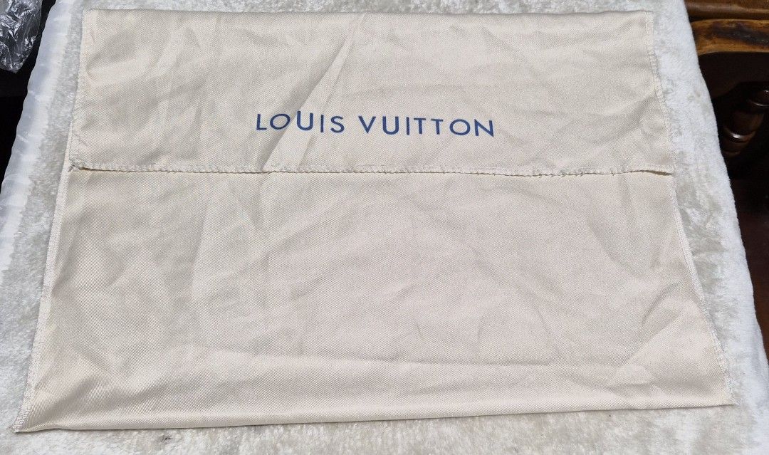 Louis Vuitton Dust Bag (Category: Baby Monitors) located in Mandaue City. Submitted by chuchi152615 (Listing ID 1462741741, Image 2). Description: - Louis Vuitton dust bag - Color: Beige with blue logo - Approximate Size: 18 inches x 19 inches - Ideal for storing handbags or shoes - Protects items from dust and scratches - Clean and ready for a new owner.