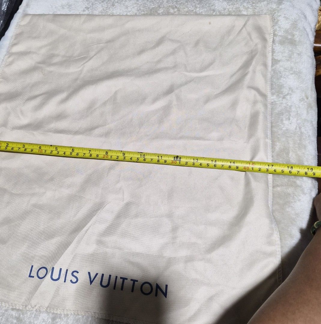 Louis Vuitton Dust Bag (Category: Baby Monitors) located in Mandaue City. Submitted by chuchi152615 (Listing ID 1462741741, Image 3). Description: - Louis Vuitton dust bag - Color: Beige with blue logo - Approximate Size: 18 inches x 19 inches - Ideal for storing handbags or shoes - Protects items from dust and scratches - Clean and ready for a new owner.