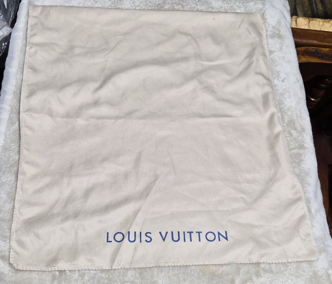 Louis Vuitton Dust Bag (Category: Baby Monitors) located in Mandaue City. Submitted by chuchi152615 (Listing ID 1462741741, Image 1). Description: - Louis Vuitton dust bag - Color: Beige with blue logo - Approximate Size: 18 inches x 19 inches - Ideal for storing handbags or shoes - Protects items from dust and scratches - Clean and ready for a new owner.