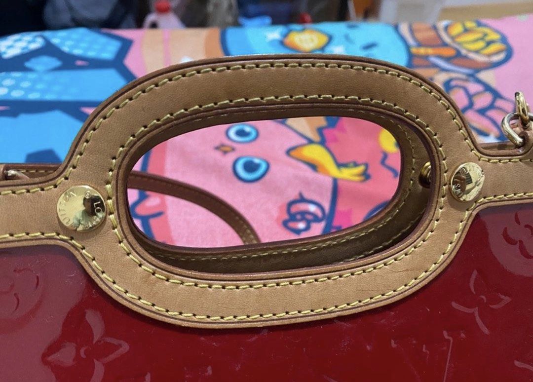 Louis Vuitton Monogram Vernis Roxbury (Category: Luxury Bags & Wallets) located in Tarlac. Submitted by rizasdeclutteringonline (Listing ID 1462853607, Image 3). Description: - Authentic Red Louis Vuitton Monogram Vernis handbag - Features a classic top handle - Includes a detachable shoulder strap for versatile carrying - Elegant gold hardware details - Comes with original dust bag - A timeless and iconic piece for your collection -LV Roxbury - 