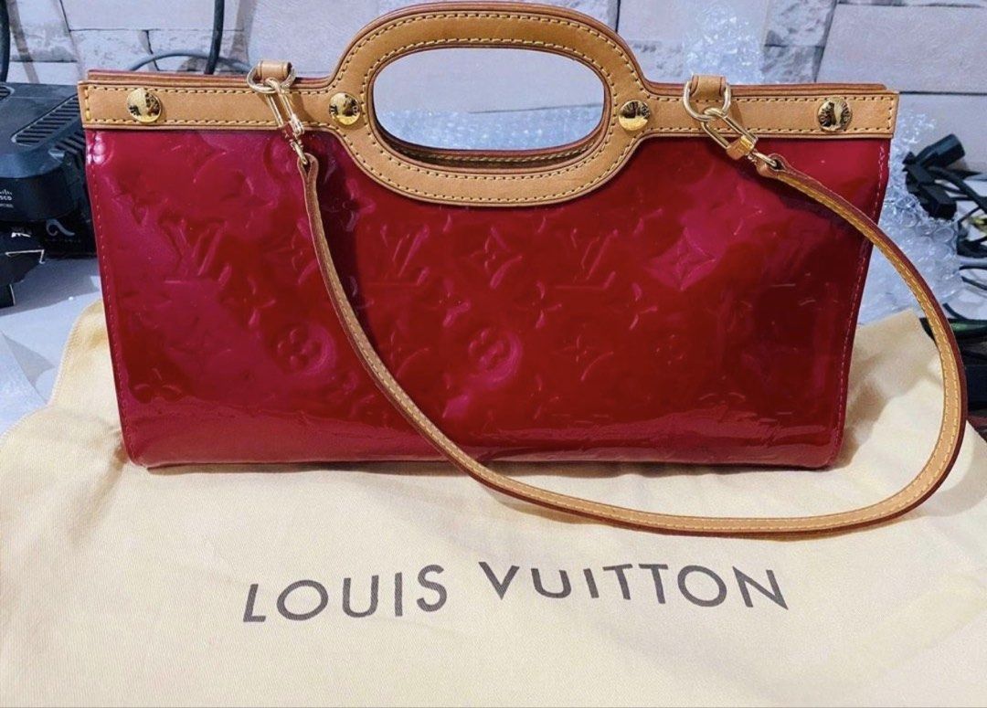 Louis Vuitton Monogram Vernis Roxbury (Category: Luxury Bags & Wallets) located in Tarlac. Submitted by rizasdeclutteringonline (Listing ID 1462853607, Image 1). Description: - Authentic Red Louis Vuitton Monogram Vernis handbag - Features a classic top handle - Includes a detachable shoulder strap for versatile carrying - Elegant gold hardware details - Comes with original dust bag - A timeless and iconic piece for your collection -LV Roxbury - 