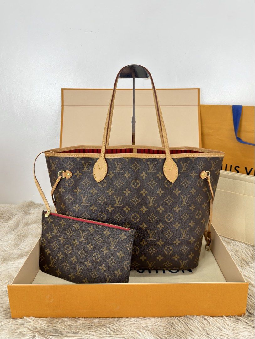 Louis Vuitton Neverfull MM Monogram With Pouch (Category: Luxury Bags & Wallets) located in Manila. Submitted by luxuryprelovedbagsby_by_agnes (Listing ID 1462843061, Image 1). Description: 125K SRP Excellent Condition / Fresh Coded / Microchipped Hard to Source Dimensions: 47cm x 28cm x 14cm.