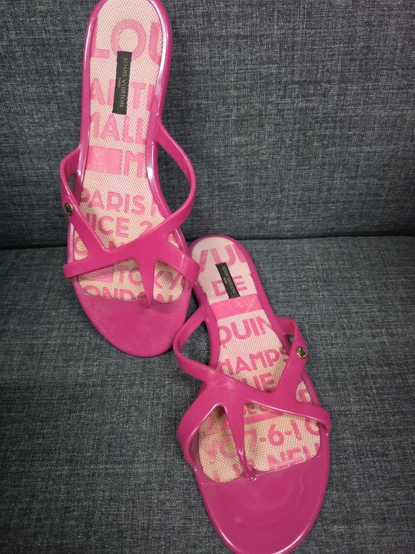 Louis Vuitton Pink Jelly Sandals (Category: Flats & Sandals) located in General Trias. Submitted by roselle2230 (Listing ID 1462832902, Image 2). Description: - Authentic Louis Vuitton jelly sandals - Bright pink color - Features LV monogram pattern on insoles - Strappy design with a small gold accent - Perfect for beach days or casual outings - Made in Italy.
