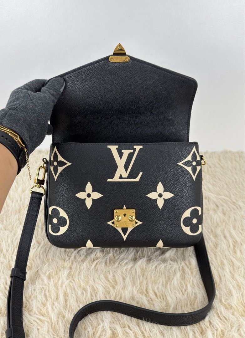 Louis Vuitton Pochette Métis Bicolor Monogram Empreinte (Category: Luxury Bags & Wallets) located in Manila. Submitted by luxuryprelovedbagsby_by_agnes (Listing ID 1462844170, Image 2). Description: Excellent Condition Microchipped / With Entrupy Certificate Dimensions: 25cm x 19cm x 7cm.