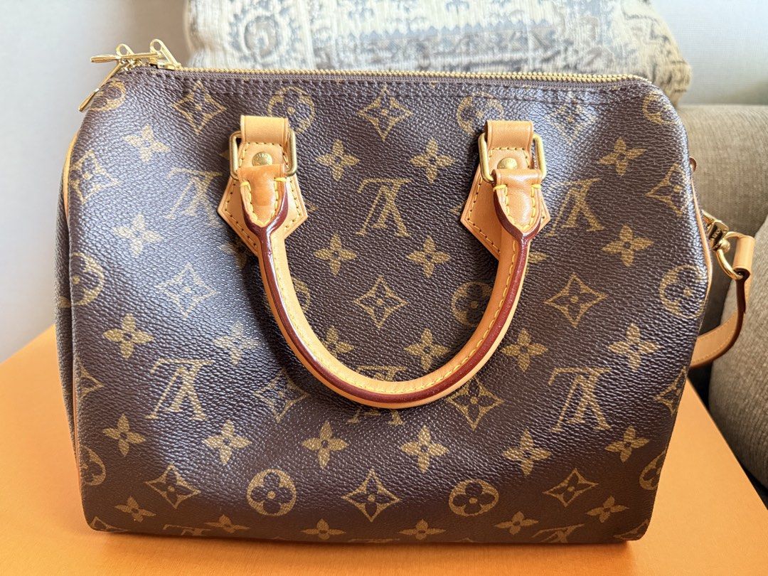 Louis Vuitton Speedy Bandou (Category: Luxury Bags & Wallets) located in Manila. Submitted by purplebunnie1 (Listing ID 1462769784, Image 1). Description: - Classic Louis Vuitton Speedy bag in iconic monogram canvas. - Genuine leather trim and handles. - Secure zipper closure. - Interior zippered pocket for essentials. - Detachable shoulder strap included for versatile carrying options. - Ideal as a stylish everyday bag. -No lock set -with 3 lett