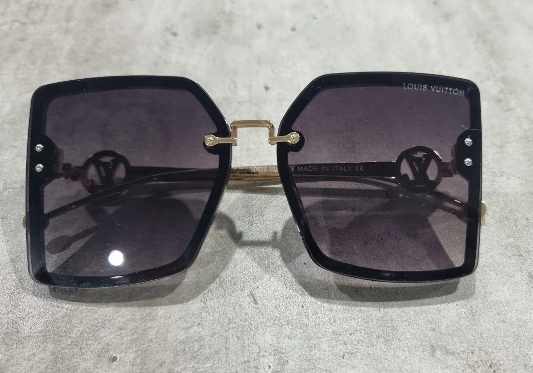 Louis Vuitton Sunglasses Square Black Gold (Category: Sunglasses & Eyewear) located in Makati City. Submitted by zshar (Listing ID 1462837922, Image 1). Description: - Louis Vuitton sunglasses - Stylish square frames in black - Elegant gold accents - Dark tinted lenses - Made in Italy - Perfect accessory for any outfit and sunny days. Bought in Amazon.