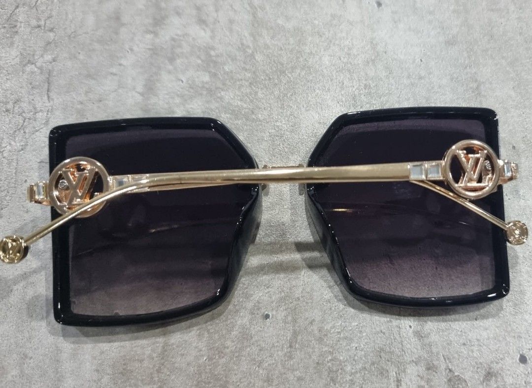 Louis Vuitton Sunglasses Square Black Gold (Category: Sunglasses & Eyewear) located in Makati City. Submitted by zshar (Listing ID 1462837922, Image 3). Description: - Louis Vuitton sunglasses - Stylish square frames in black - Elegant gold accents - Dark tinted lenses - Made in Italy - Perfect accessory for any outfit and sunny days. Bought in Amazon.