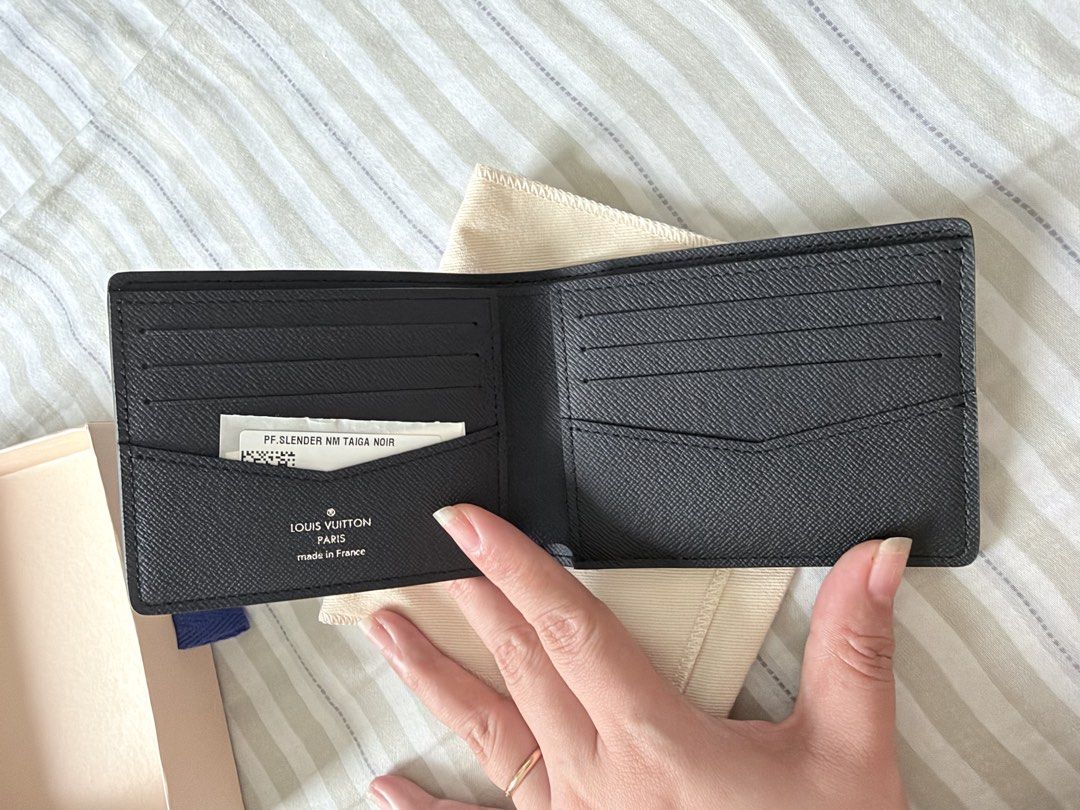 Louis Vuitton Taiga Leather Slender Wallet Noir (Category: Luxury Bags & Wallets) located in Makati City. Submitted by rain3dr0ps (Listing ID 1462728074, Image 3). Description: - Authentic Louis Vuitton Slender NM Wallet - Material: Taiga Leather - Color: Noir (Black) - Features: Multiple card slots - Includes: Original box and dust bag - Authenticity guaranteed: Purchased directly from Louis Vuitton Ion Orchard Ships from Makati Payment via BPI 