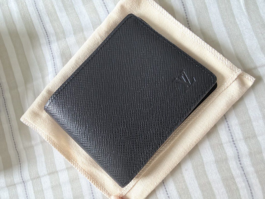 Louis Vuitton Taiga Leather Slender Wallet Noir (Category: Luxury Bags & Wallets) located in Makati City. Submitted by rain3dr0ps (Listing ID 1462728074, Image 2). Description: - Authentic Louis Vuitton Slender NM Wallet - Material: Taiga Leather - Color: Noir (Black) - Features: Multiple card slots - Includes: Original box and dust bag - Authenticity guaranteed: Purchased directly from Louis Vuitton Ion Orchard Ships from Makati Payment via BPI 