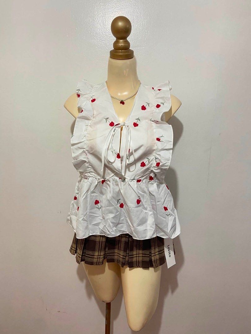 Lovito White Floral Tie-Front Ruffle Peplum Top (Category: Blouses) located in Mandaluyong City. Submitted by cxia_style (Listing ID 1462762608, Image 1). Description: details: ୨ৎ lovito brand ୨ৎ polyester fabric ୨ৎ non stretch ୨ৎ v-neckline.