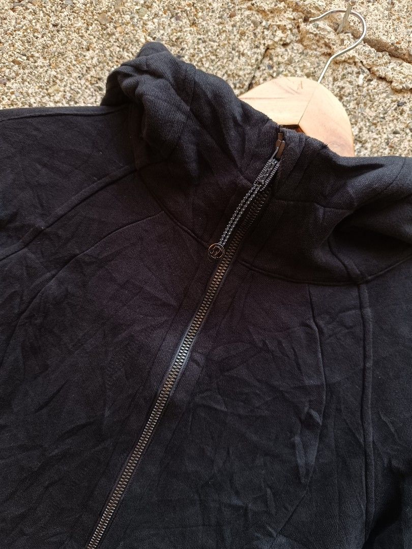 Lululemon Black Full Zip Hoodie Jacket Size 4 (Category: Coats, Jackets and Outerwear) located in Tubigon. Submitted by thrift_mac (Listing ID 1462843995, Image 3). Description: - Black Lululemon hoodie jacket - Full zip closure with high neck and hood - Thumbholes on sleeves - Made in Vietnam - Cotton blend fabric - Ideal for workouts or casual wear.