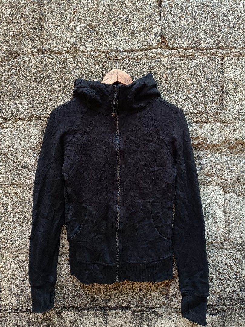 Lululemon Black Full Zip Hoodie Jacket Size 4 (Category: Coats, Jackets and Outerwear) located in Tubigon. Submitted by thrift_mac (Listing ID 1462843995, Image 1). Description: - Black Lululemon hoodie jacket - Full zip closure with high neck and hood - Thumbholes on sleeves - Made in Vietnam - Cotton blend fabric - Ideal for workouts or casual wear.