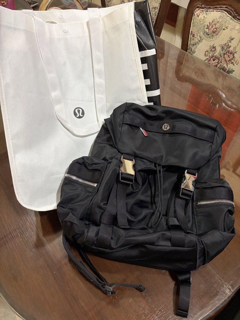 Lululemon Black Wunderlust Mini Backpack (Category: Backpacks) located in Valenzuela. Submitted by cheerios09 (Listing ID 1462783043, Image 2). Description: RFS: gift; but prefer my kanken for travel - Drawstring closure with buckle straps - Multiple zip pockets (front and sides) - Adjustable padded shoulder straps - Comes with a Lululemon tote bag Bdo/gcash/ub Free ship to metro manila.