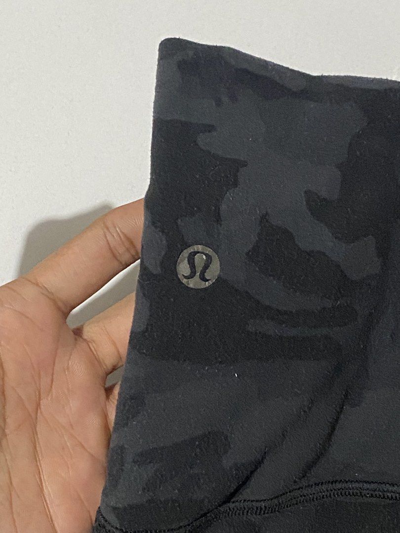 Lululemon leggings in a black or dark grey camo pattern (Category: Activewear) located in Naga. Submitted by jamesarkkkk (Listing ID 1462850232, Image 2). Description: minimal issue.
