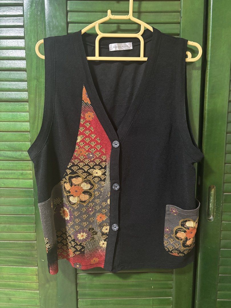 MAGLIONE MILLIONE Black Vest with Floral Patchwork (Category: Sleeveless) located in Ilagan. Submitted by ystroberry (Listing ID 1462793758, Image 1). Description: - Brand: MAGLIONE MILLIONE - Color: Black - Style: Vest - Features: Unique patchwork design on front left, pocket on right - Closure: Button-up - Versatile: Great for layering and styling with various outfits fits S-M .