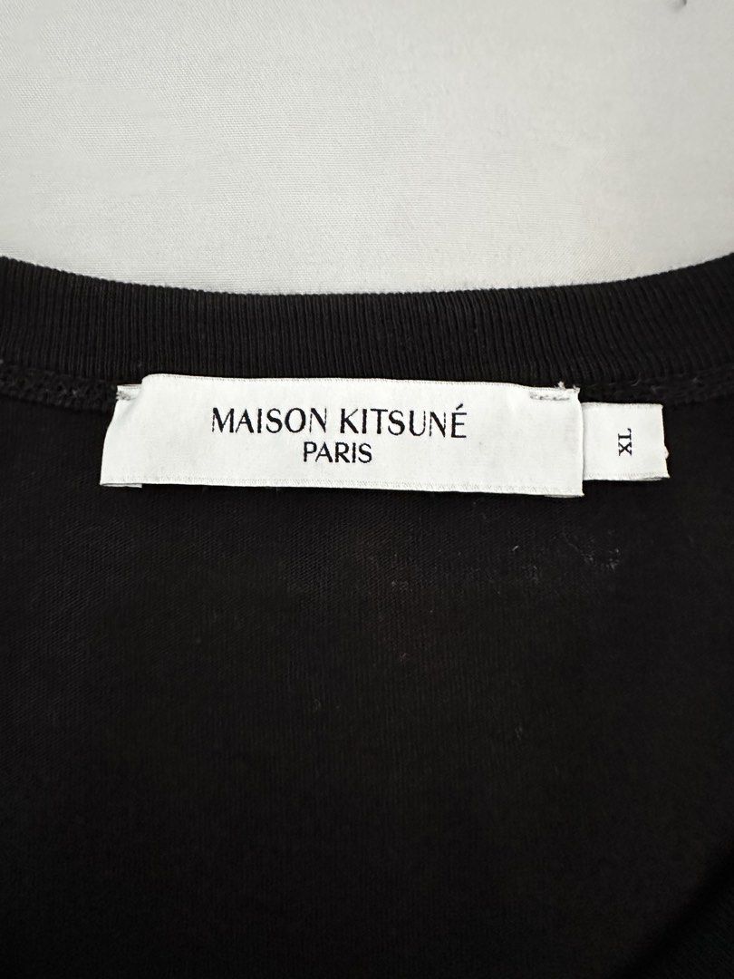 Maison Kitsune Tshirt (Category: Tshirts & Polo Shirts ) located in Manila. Submitted by specsphmnl (Listing ID 1462766699, Image 3). Description: Maison Kitsune Dressed Fox Patch Classic Tee XL (22x28.5 inches) Unisex 100% Original In very good condition (used once only) Personal used ₱3,500 Meet up Location: -Don Carlos Palanca St., Legaspi Village, Makati Shipping: Grab or Lalamove (buyer will shoulder shipping fee).