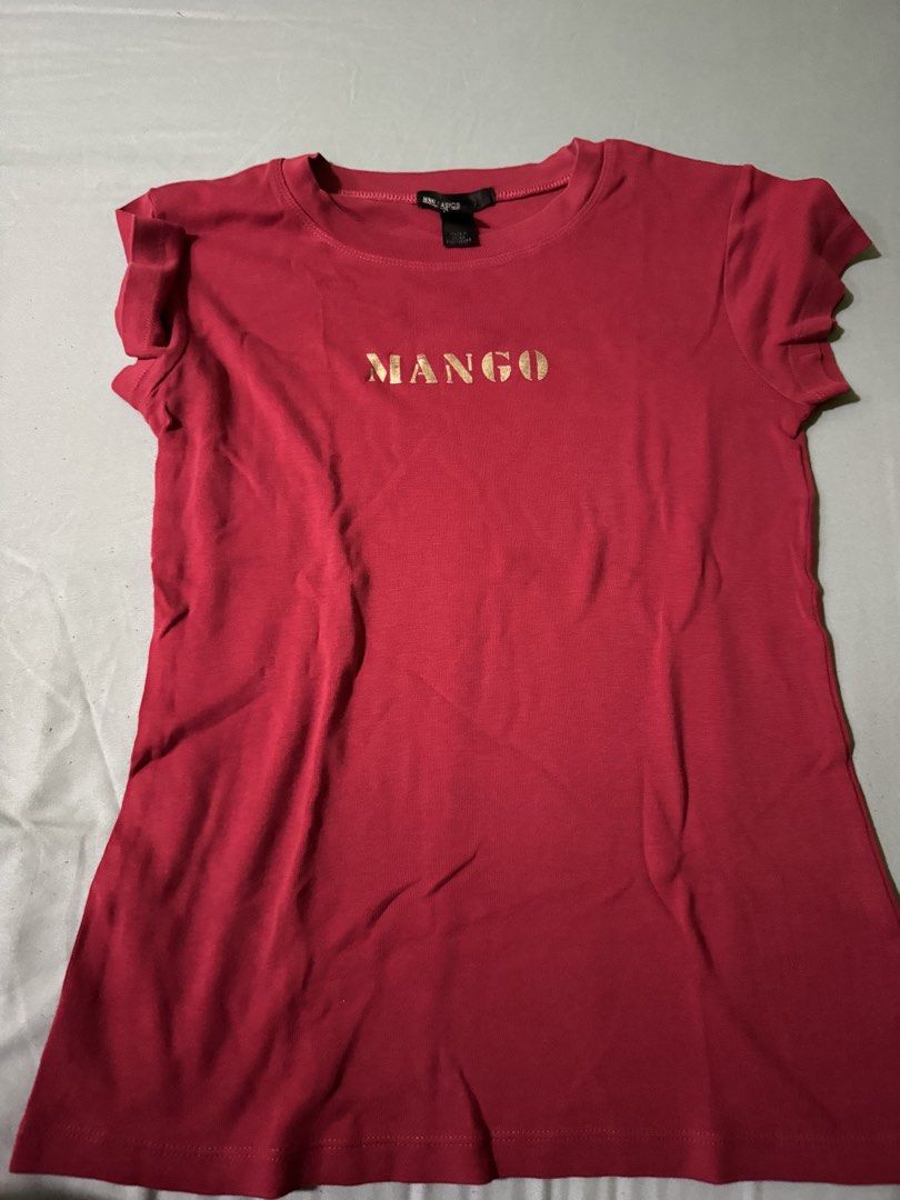 Mango Basics Red T-shirt with Gold Logo (Category: Shirts) located in Cainta. Submitted by stellar_closet (Listing ID 1462799648, Image 1). Description: - Mango Basics Red T-Shirt - Size: Medium (M) - Features a stylish gold Mango logo on the front - Short sleeves for comfort - Ideal for everyday, casual wear.