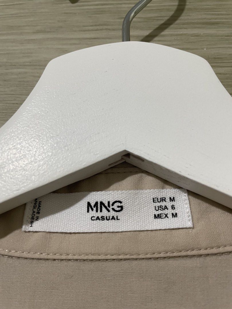 Mango mini dress (Category: Dresses) located in Manila. Submitted by isabelle_1104 (Listing ID 1462845045, Image 1). Description: - MNG Casual Shirt - Size: Medium (M) - Color: Beige/Tan - Origin: Made in Bangladesh - Style: Simple and versatile, perfect for everyday wear - Features: Great for layering or wearing on its own.