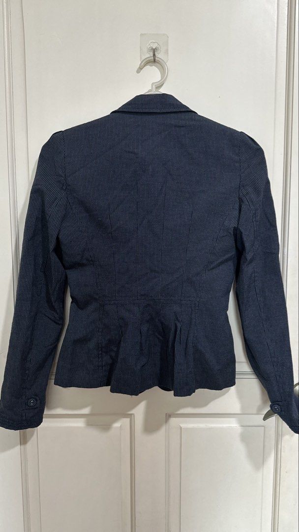 Mango Suit Navy Pinstripe Blazer (Category: Coats, Jackets and Outerwear) located in Mandaluyong City. Submitted by yv.stuff (Listing ID 1462768049, Image 3). Description: - Navy blue blazer from Mango Suit - Classic pinstripe pattern - Single-breasted with a two-button front - Stylish peplum detail at the waist - Ideal for workwear or smart casual outfits - Refer to label for exact sizing.