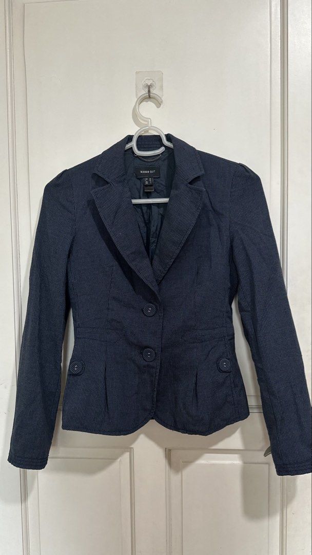 Mango Suit Navy Pinstripe Blazer (Category: Coats, Jackets and Outerwear) located in Mandaluyong City. Submitted by yv.stuff (Listing ID 1462768049, Image 1). Description: - Navy blue blazer from Mango Suit - Classic pinstripe pattern - Single-breasted with a two-button front - Stylish peplum detail at the waist - Ideal for workwear or smart casual outfits - Refer to label for exact sizing.