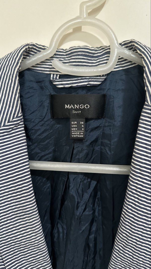 Mango Suit Striped Blazer (Category: Coats, Jackets and Outerwear) located in Mandaluyong City. Submitted by yv.stuff (Listing ID 1462768405, Image 2). Description: - Mango Suit navy and white striped blazer - Single button closure - Fully lined interior - Versatile for work or evening wear - Great for layering - Made in Vietnam.
