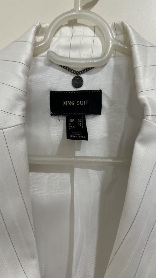 Mango Suit White Pinstripe Blazer (Category: Coats, Jackets and Outerwear) located in Mandaluyong City. Submitted by yv.stuff (Listing ID 1462768762, Image 2). Description: - MNG SUIT white blazer - Subtle pinstripe detail - Two-button front closure - Two flap pockets - Sharp and professional look - Ideal for work or dressing up outfits - Size: EUR 36 / USA 4.