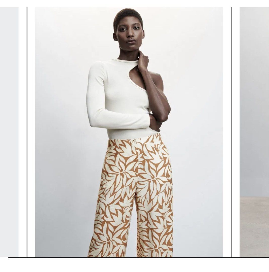 Mango Tulipa Leaf Print Wide Leg Trousers (Category: Other Bottoms) located in Cagayan de Oro. Submitted by jeirn (Listing ID 1462764200, Image 3). Description: Retails 3.3k - Wide leg trousers - Beige and brown leaf print - High-waisted design - Size L - Perfect for casual or dressed-up outfits.