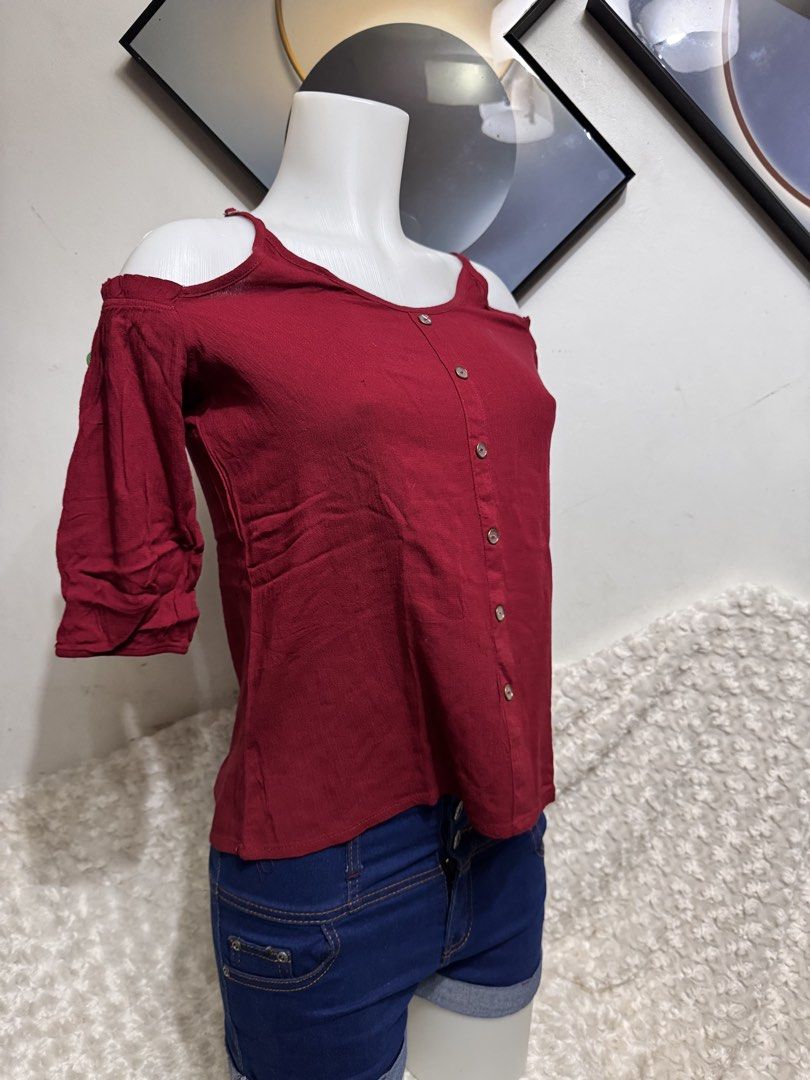 Maroon off Shoulder blouse (Category: Blouses) located in Marikina City. Submitted by lorradel (Listing ID 1462771869, Image 2). Description: - fits S-M - Maroon cold shoulder top - Button-down design - Short sleeves off shoulder - Versatile: pairs well with shorts or jeans - Ideal for casual outings - Comfortable fabric - MAY HAVE some washable stains (hindi maiiwasan) needs washing; had been stored - mannequin size 34-26-34 - mannequin’s should
