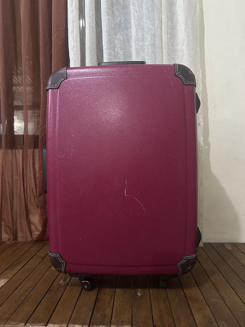 Maruem Crew Hard Shell Suitcase (Category: Luggage) located in Taguig. Submitted by ghiebow06 (Listing ID 1462757129, Image 3). Description: Built-in lock with keys Dimensions: H- 26 W- 18 D- 8 1/2 - Burgundy hard shell suitcase - Classic vintage look with brown leather trim - Leather corner protectors - Retractable handle for easy carrying - Wheels for smooth transport - Perfect for your next trip!.