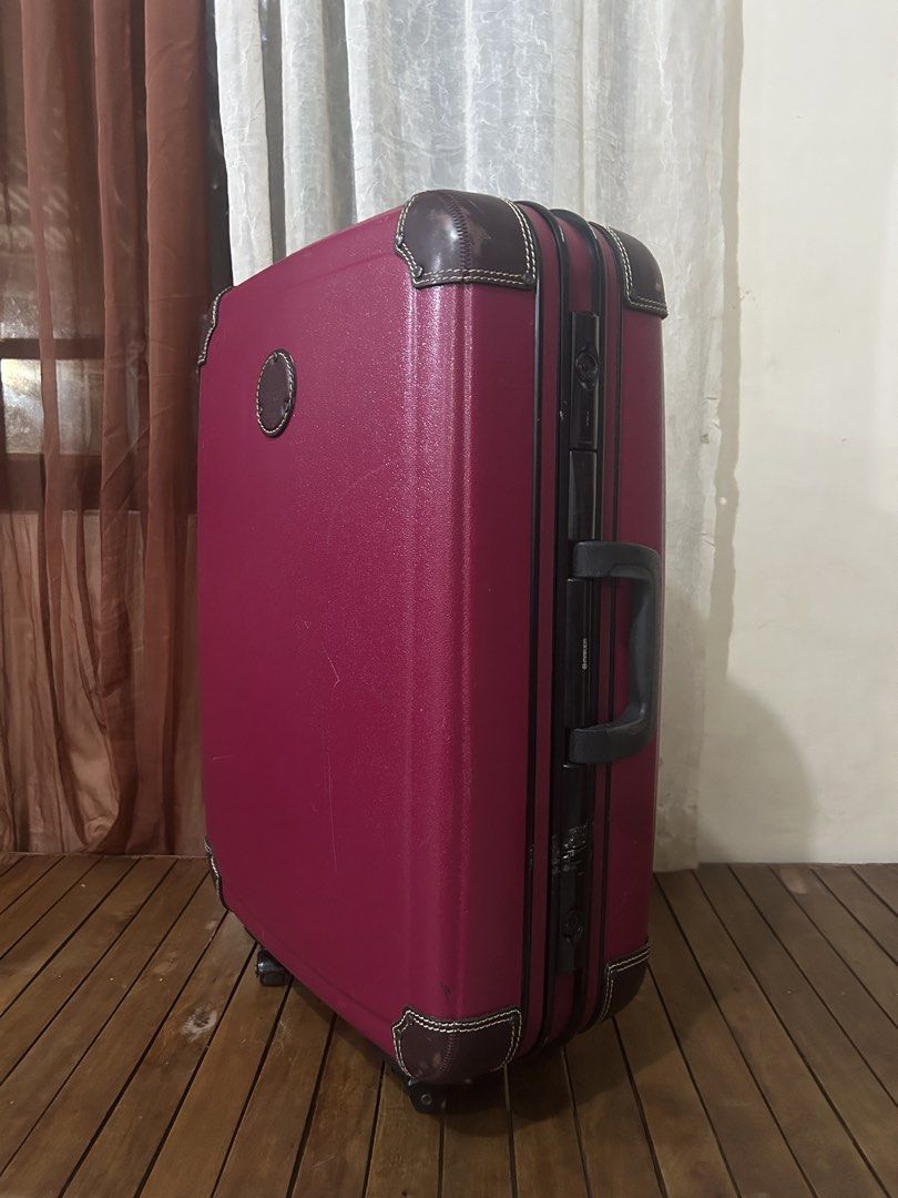 Maruem Crew Hard Shell Suitcase (Category: Luggage) located in Taguig. Submitted by ghiebow06 (Listing ID 1462757129, Image 2). Description: Built-in lock with keys Dimensions: H- 26 W- 18 D- 8 1/2 - Burgundy hard shell suitcase - Classic vintage look with brown leather trim - Leather corner protectors - Retractable handle for easy carrying - Wheels for smooth transport - Perfect for your next trip!.