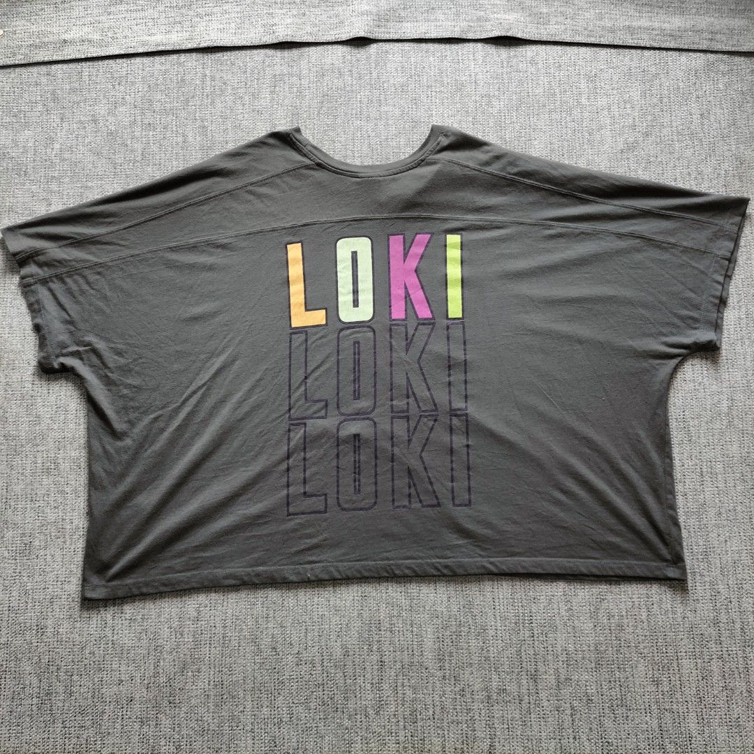Marvel Loki Glorious Purpose T-Shirt (Category: Tshirts & Polo Shirts ) located in Taytay. Submitted by calmtree-6248 (Listing ID 1462810856, Image 2). Description: - Grey Marvel t-shirt with a cool Loki graphic. - Features the text 'Glorious Purpose' on the front. - Pink trim around the neckline adds a unique touch. - Back of the shirt has a repeated 'Loki' design. - Tag indicates US/AU/UK/EU 3X size (JP バス 134-142 6L). - Perfect for any Marvel 