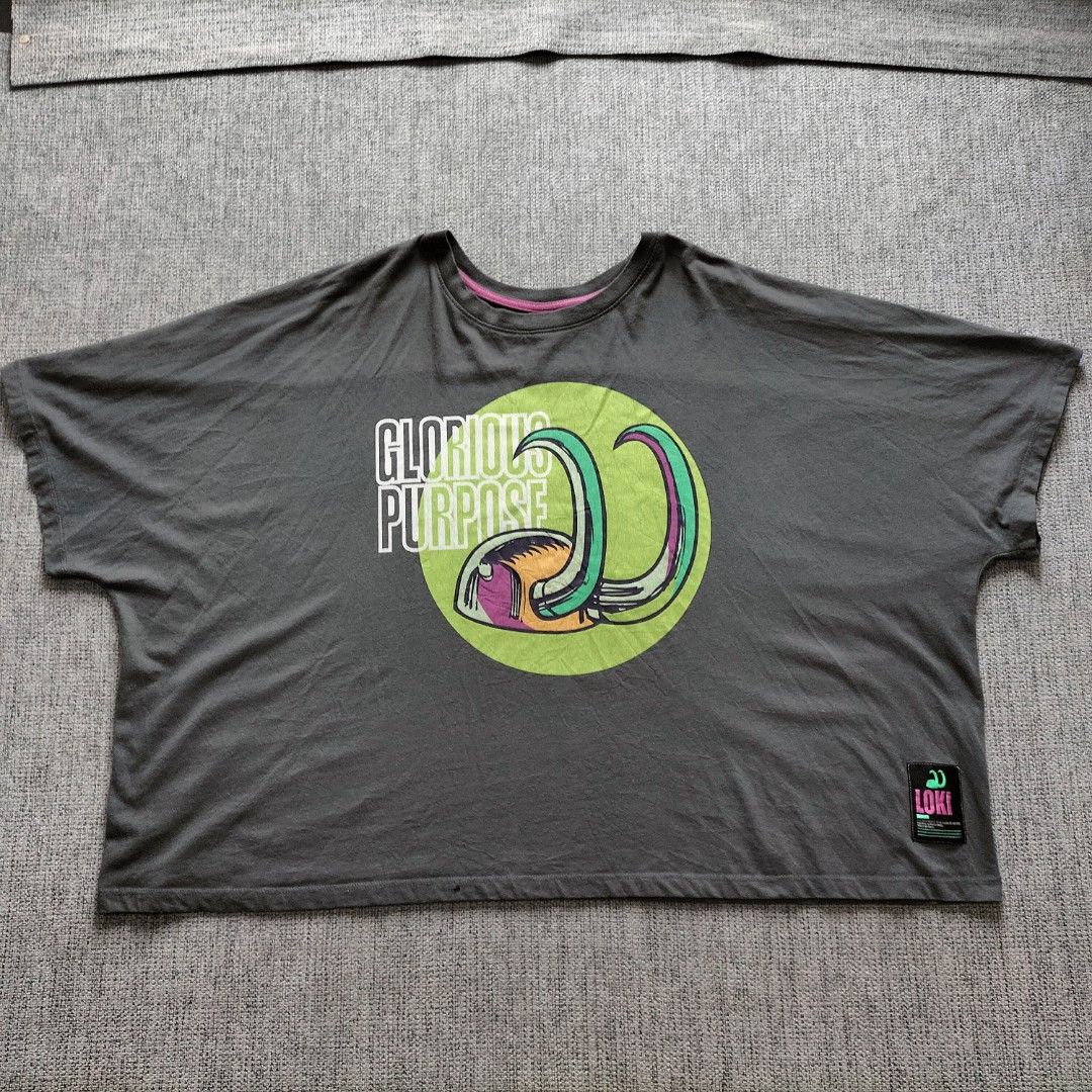 Marvel Loki Glorious Purpose T-Shirt (Category: Tshirts & Polo Shirts ) located in Taytay. Submitted by calmtree-6248 (Listing ID 1462810856, Image 1). Description: - Grey Marvel t-shirt with a cool Loki graphic. - Features the text 'Glorious Purpose' on the front. - Pink trim around the neckline adds a unique touch. - Back of the shirt has a repeated 'Loki' design. - Tag indicates US/AU/UK/EU 3X size (JP バス 134-142 6L). - Perfect for any Marvel 