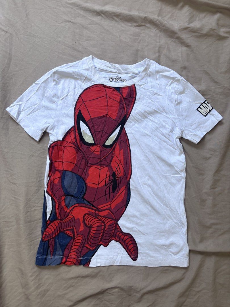 Marvel Spider-Man White T-Shirt (Category: Babies & Kids Fashion) located in Andop. Submitted by ukaylangpo (Listing ID 1462769466, Image 1). Description: - Awesome Spiderman graphic print on the front - Official Marvel logo detail on the sleeve - Brand: Next - Size: (Please refer to measurements) - Measurements: Approx. 18 inches (pit to pit) x 24 inches (length) - Ideal for any Marvel or Spiderman enthusiast - Check photos for condition and det