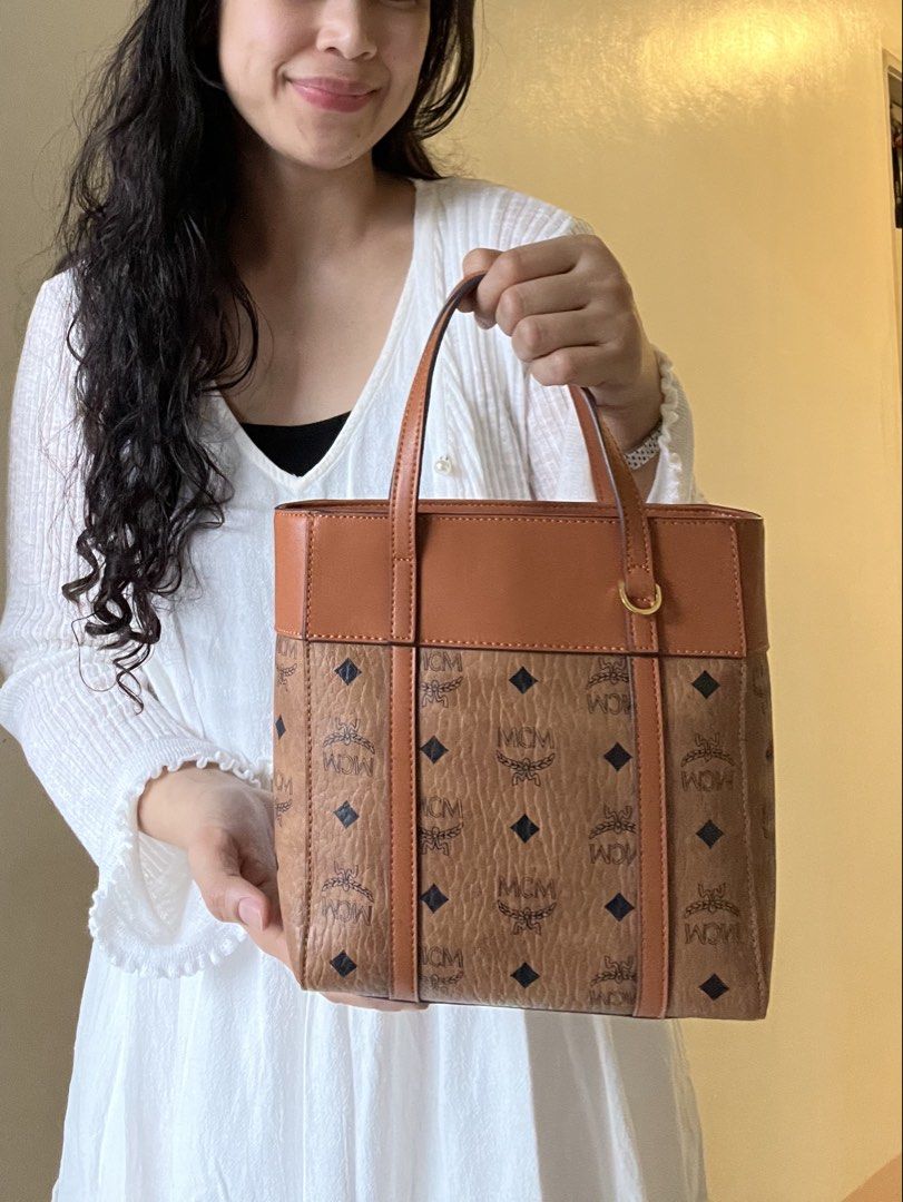 MCM mini aren bag (Category: Luxury Bags & Wallets) located in Caloocan City. Submitted by mahanne (Listing ID 1458509724, Image 3). Description: MCM Cognac Visetos Tote / Shoulder Bag – Beautiful Condition Authentic- MCM monogram tote bag in a classic cognac/caramel brown colorway. Features the iconic MCM Visetos monogram pattern with black diamond motifs, complemented by smooth leather trim and gold-tone hardware. ✨ Details: * Classic MCM monog